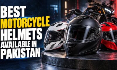 Rider holding full face motorcycle helmets in a Pakistan accessory shop