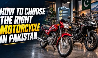 Rider comparing bikes in a showroom to choose a motorcycle in Pakistan