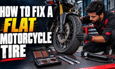 Rider using a plug kit for a motorcycle tire fix on a Pakistan roadside