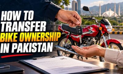 Buyer and seller completing papers to transfer bike ownership in Pakistan